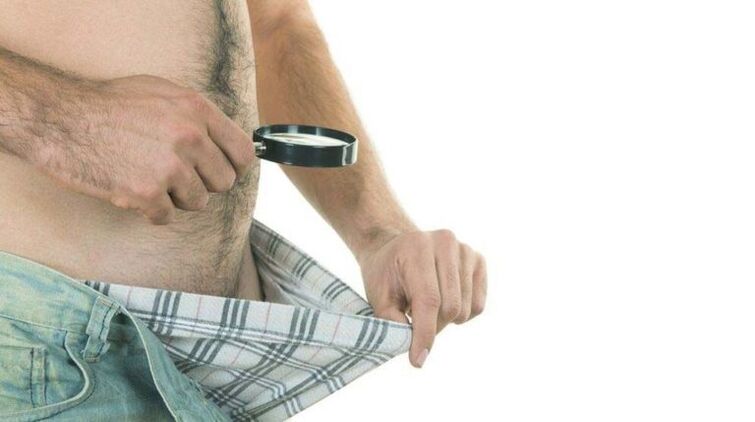 A man looks at his underwear and thinks about using soda to enlarge his penis